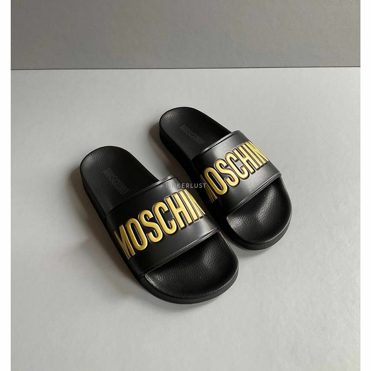 Moschino Sandal Slide Embossed Logo Gold in Black 