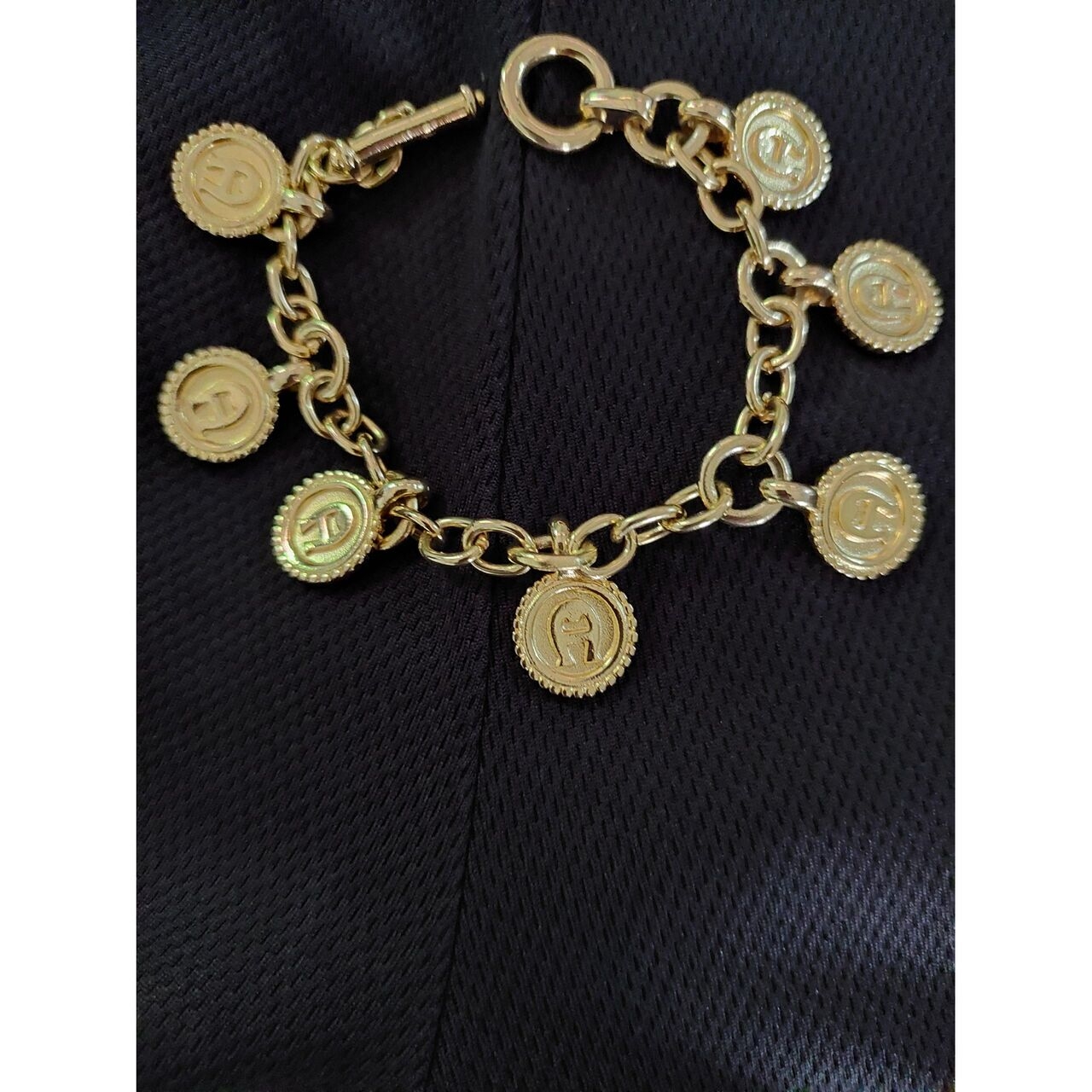 Aigner Gold Medallion And Bracelet
