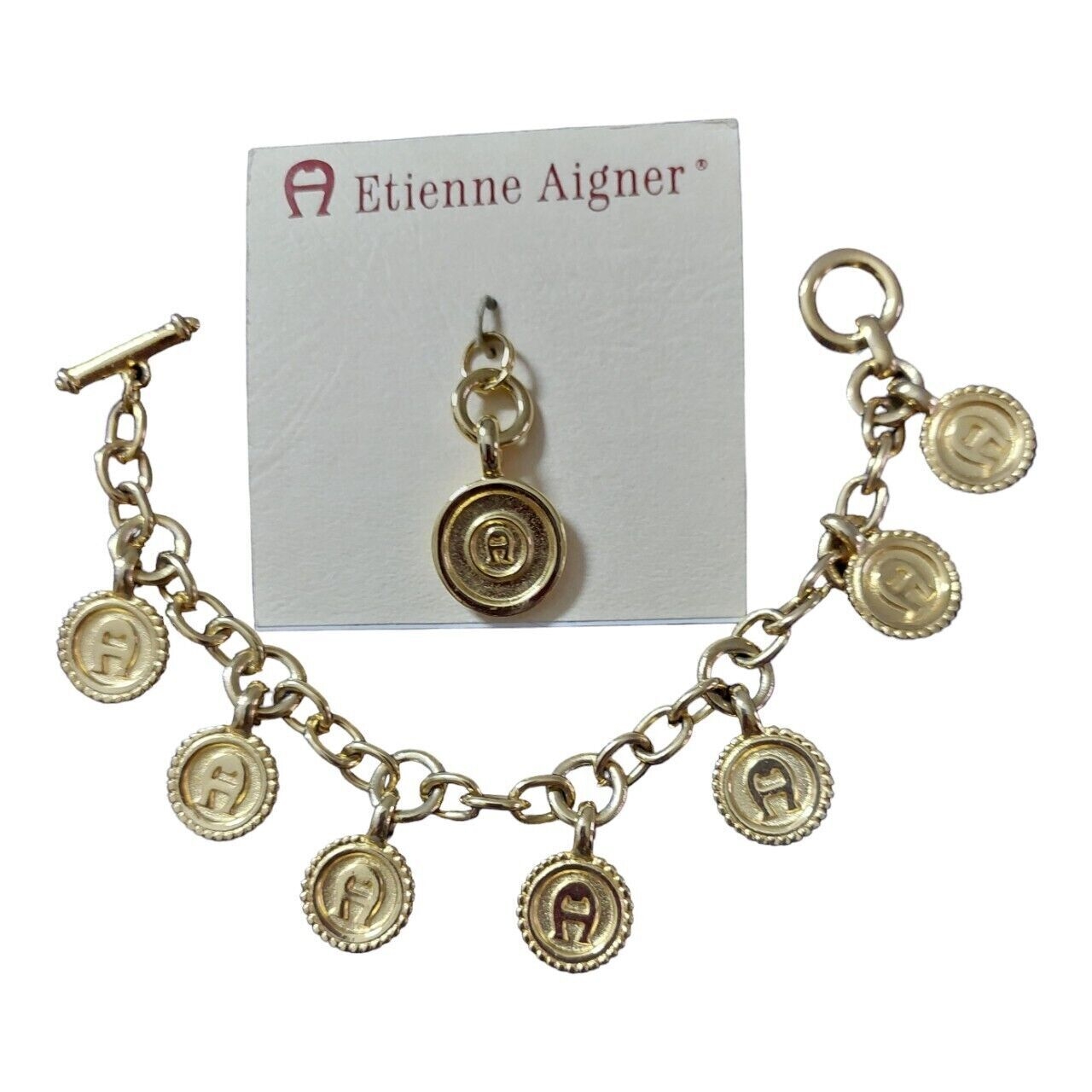 Aigner Gold Medallion And Bracelet