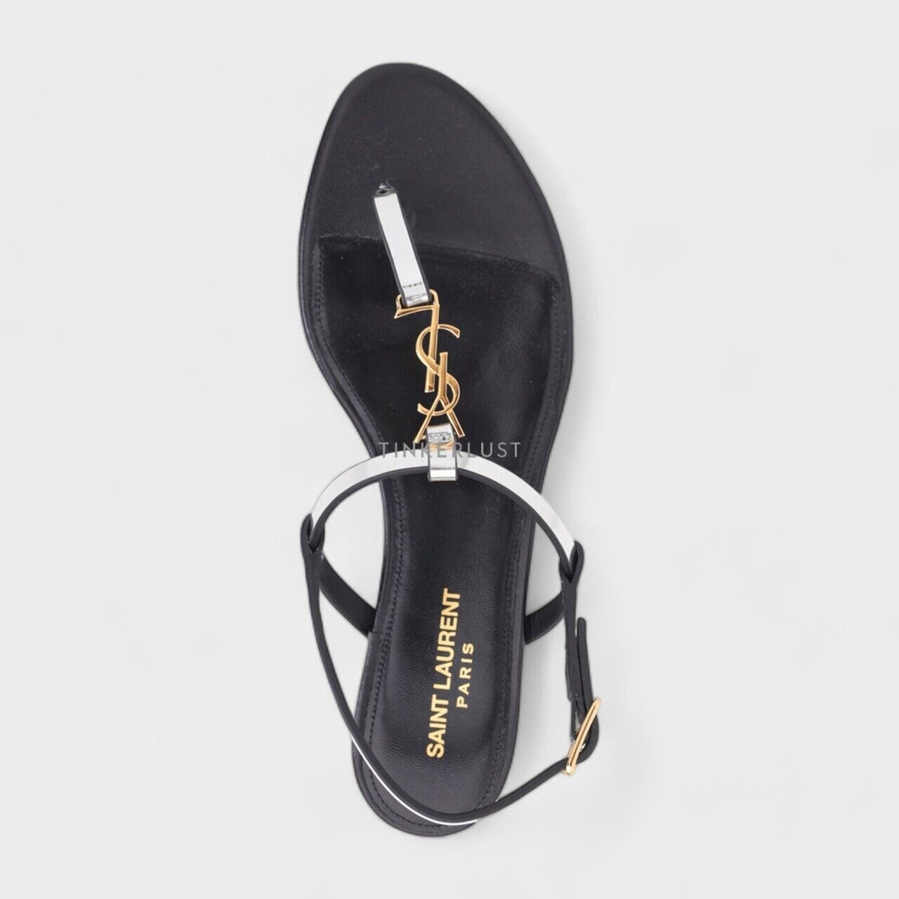 Saint Laurent Women Cassandra Flat Ankle Strap in Argent Reflective Leather with Gold-Tone Monogram Sandals