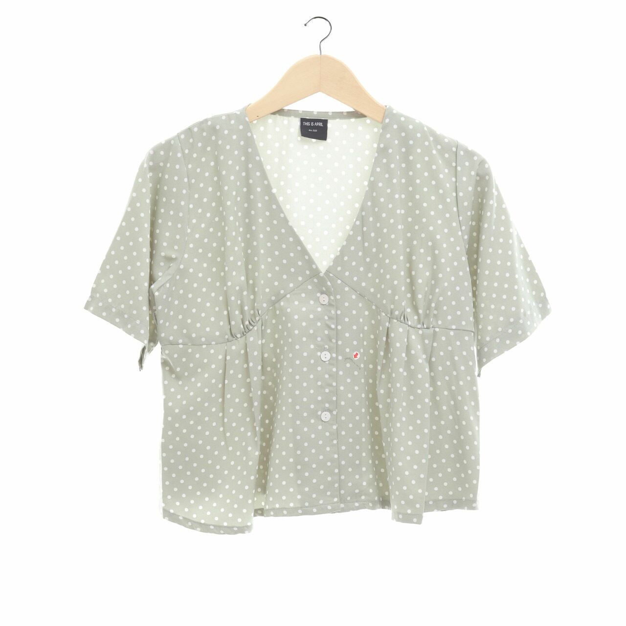 This is April Mint Polka Dot Blouse