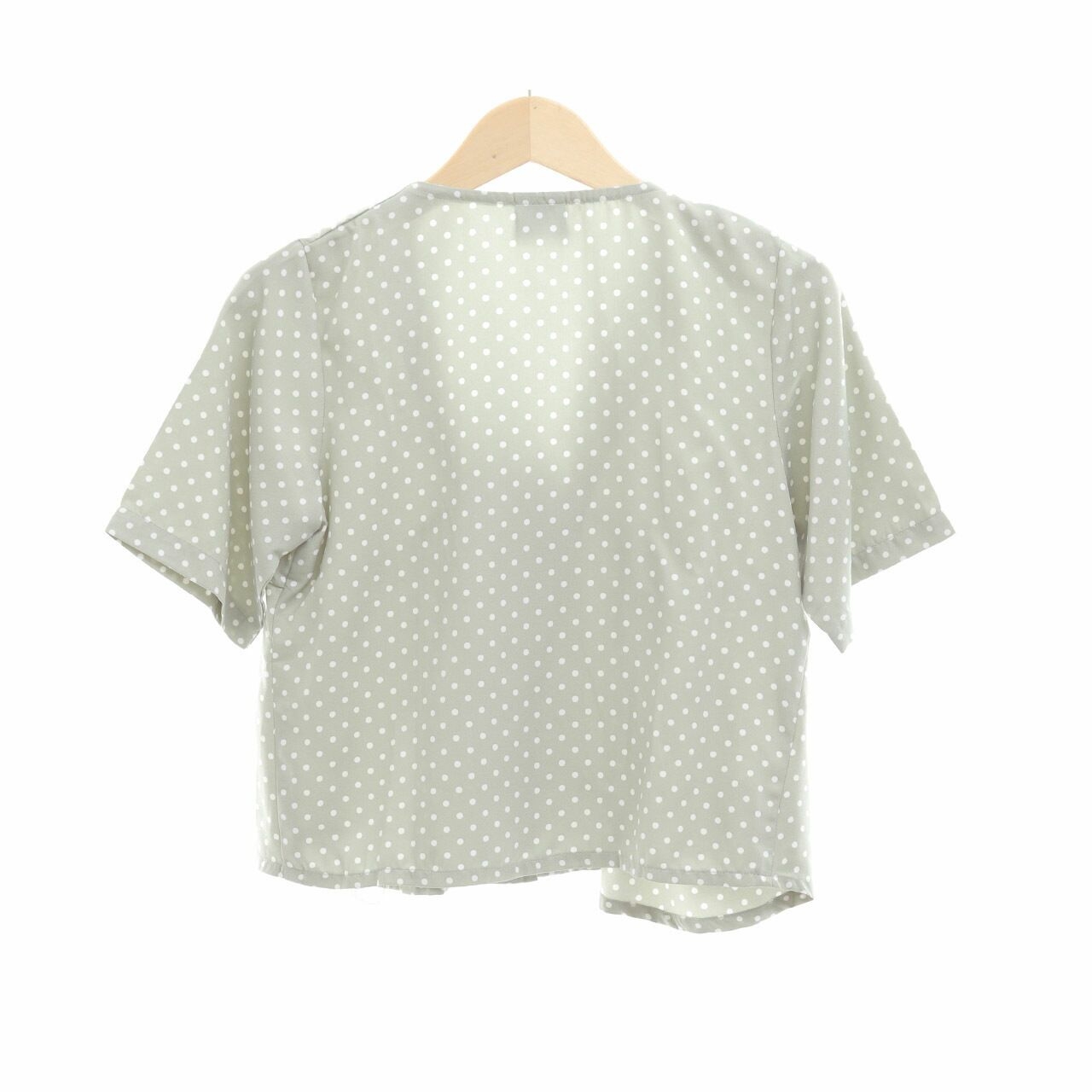 This is April Mint Polka Dot Blouse