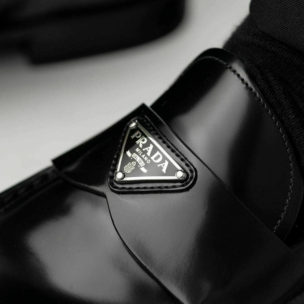 Prada Enamel Triangle Logo Leather Loafers